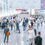 blurred business people at a trade fair